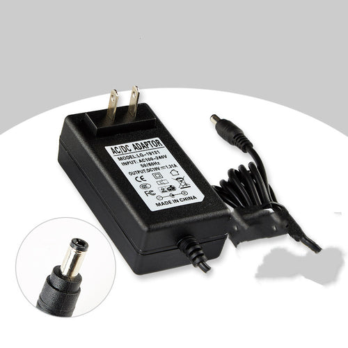 Black AC/DC adapter with power cord on a white background