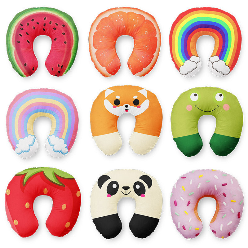 Set of colorful neck pillows shaped like fruits, animals, and a rainbow on a white background.