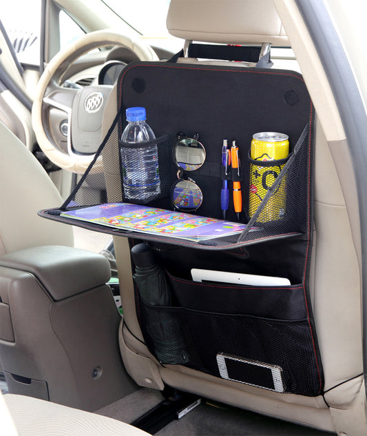 Car seat organizer with a tray, water bottle, snacks, and other items inside a vehicle.